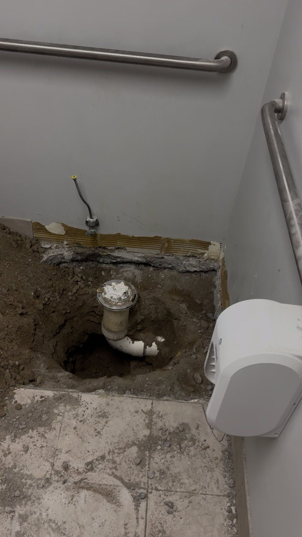 Interior bathroom tear-out and floor excavation by OARA