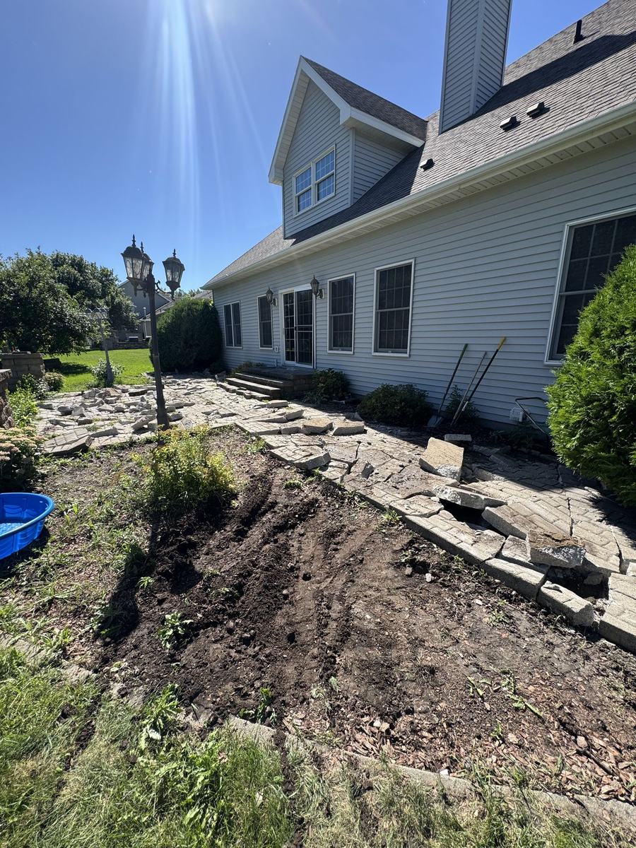 Regraded, cleared yard along a house by OARA
